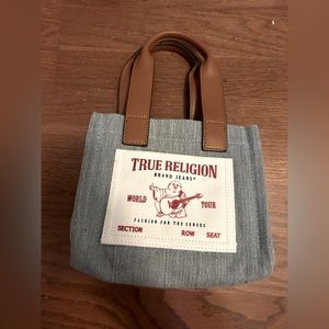 True religion bag. No rips or tears small stain from makeup on the inside